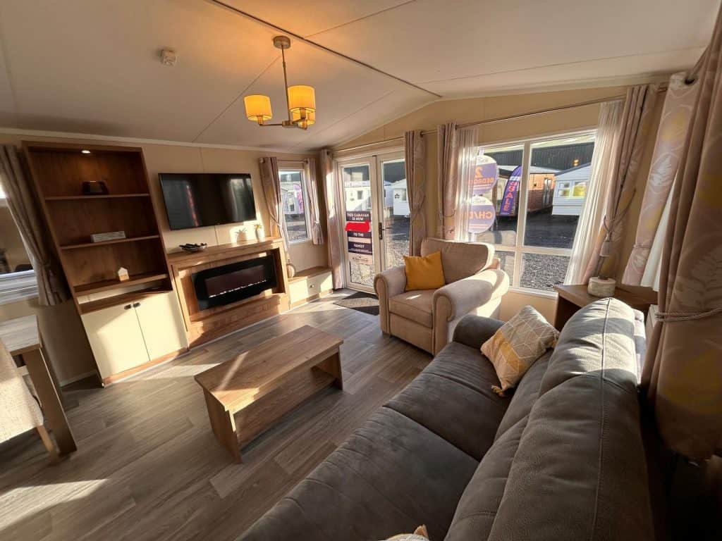 grey sofa, coffee table, tv on wall, built in shelving