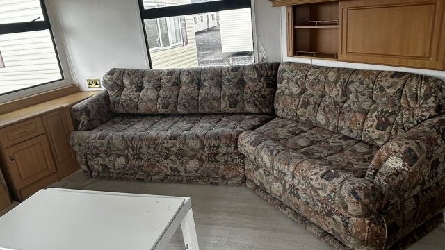 Static caravan sofas and white coffee table