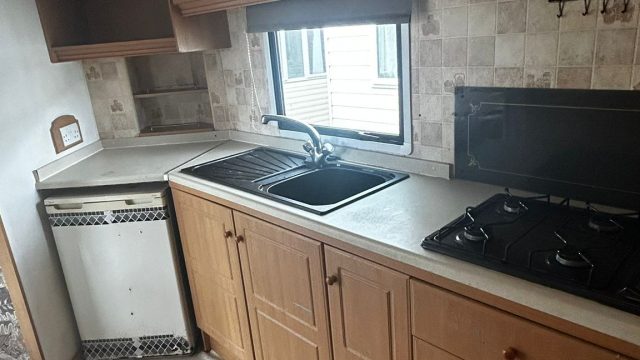 Sink and hob in a static caravan kitchen.