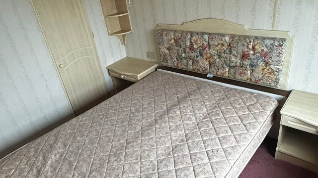 Double bed with bedside cabinets in Static Caravan