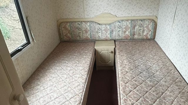 Two single beds in room