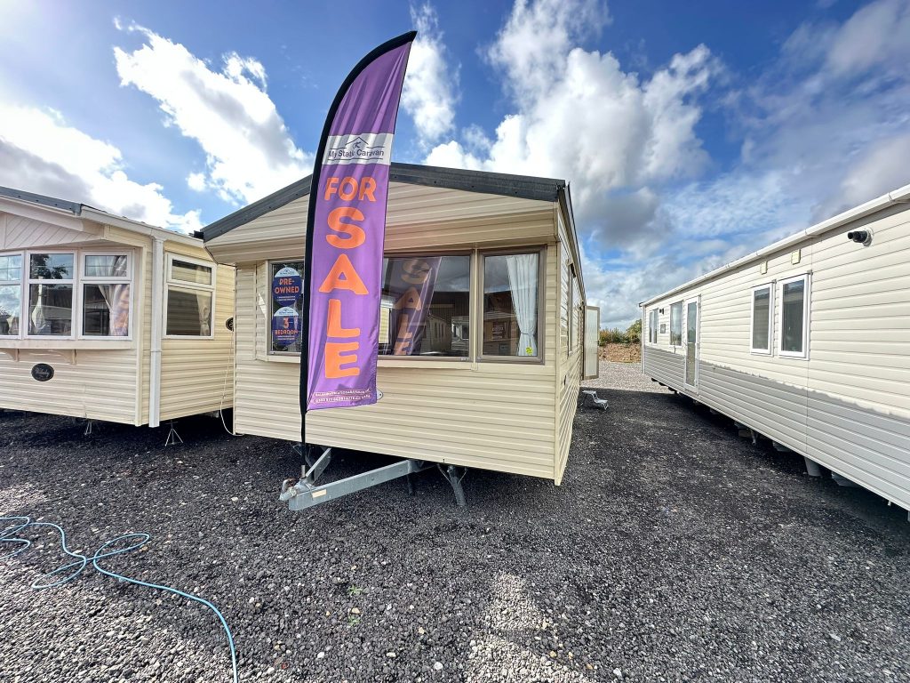 Cream Static Caravan with grey roof.