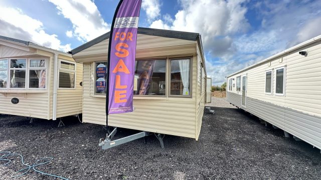 Cream Static Caravan with grey roof.