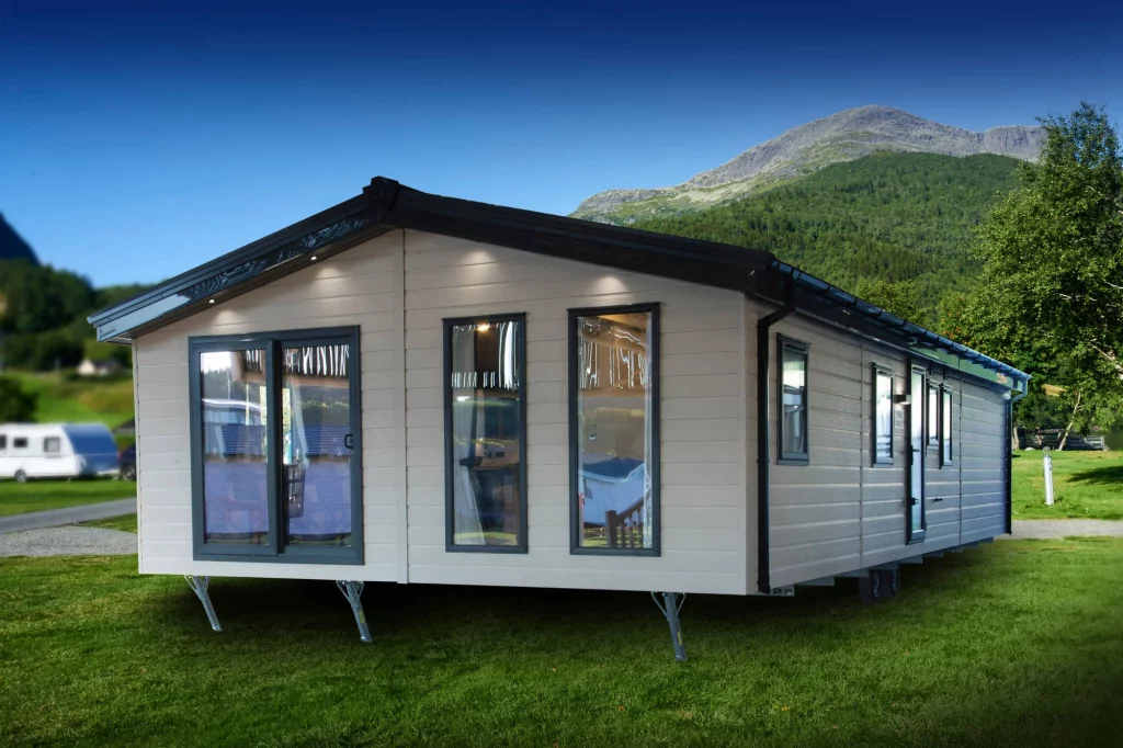 large clad lodge with patio doors and two large front windows