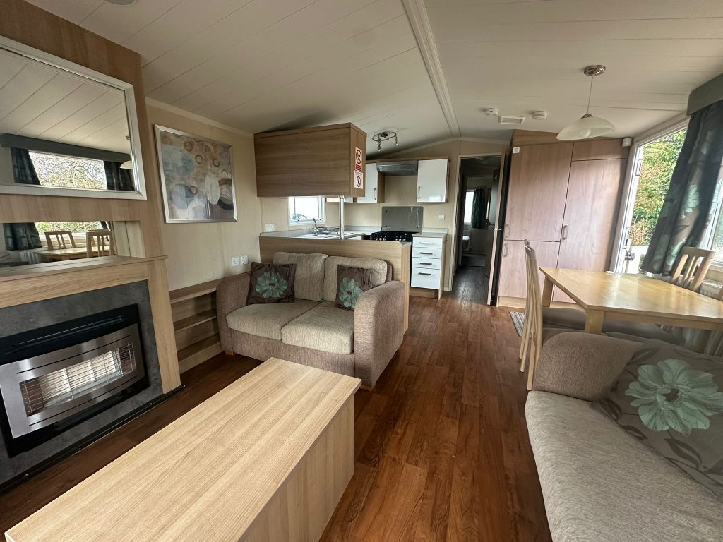 2 seater sofa, coffee table with gas fire in static caravan