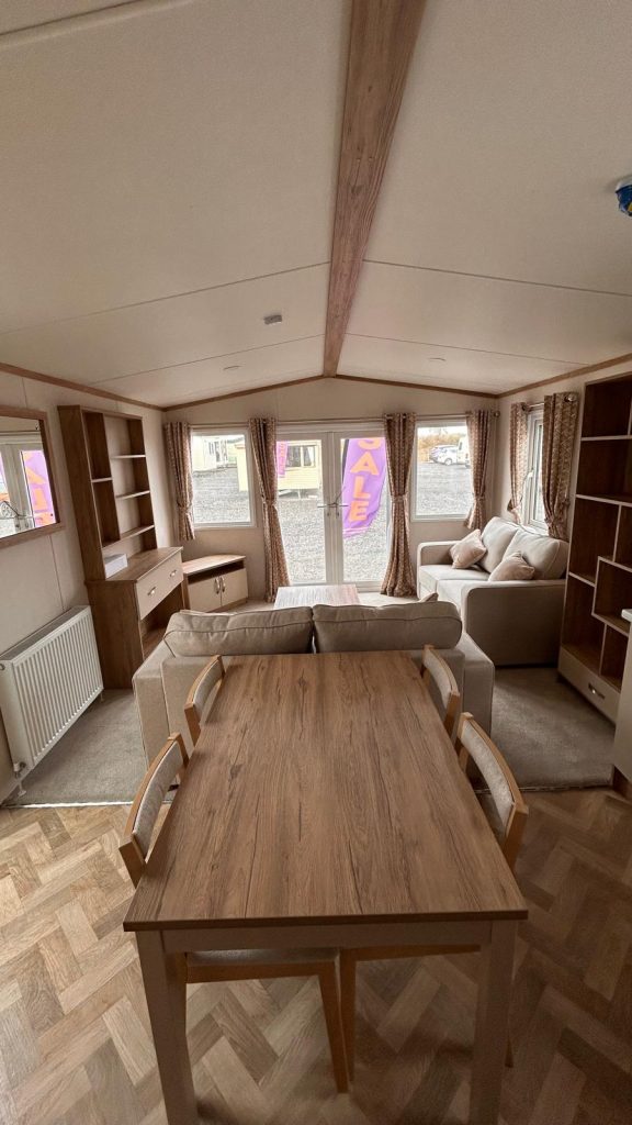 dining table with 4 chairs , view into lounge area