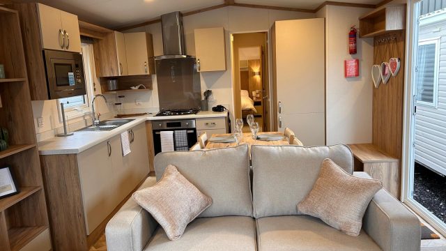 view of kitchen with built in cabinets, microwave.
