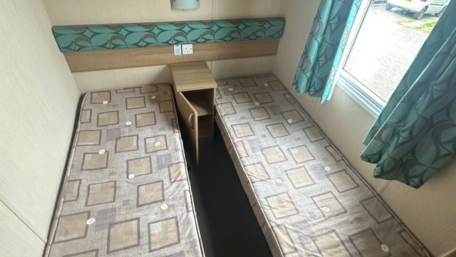 2 single beds in a room