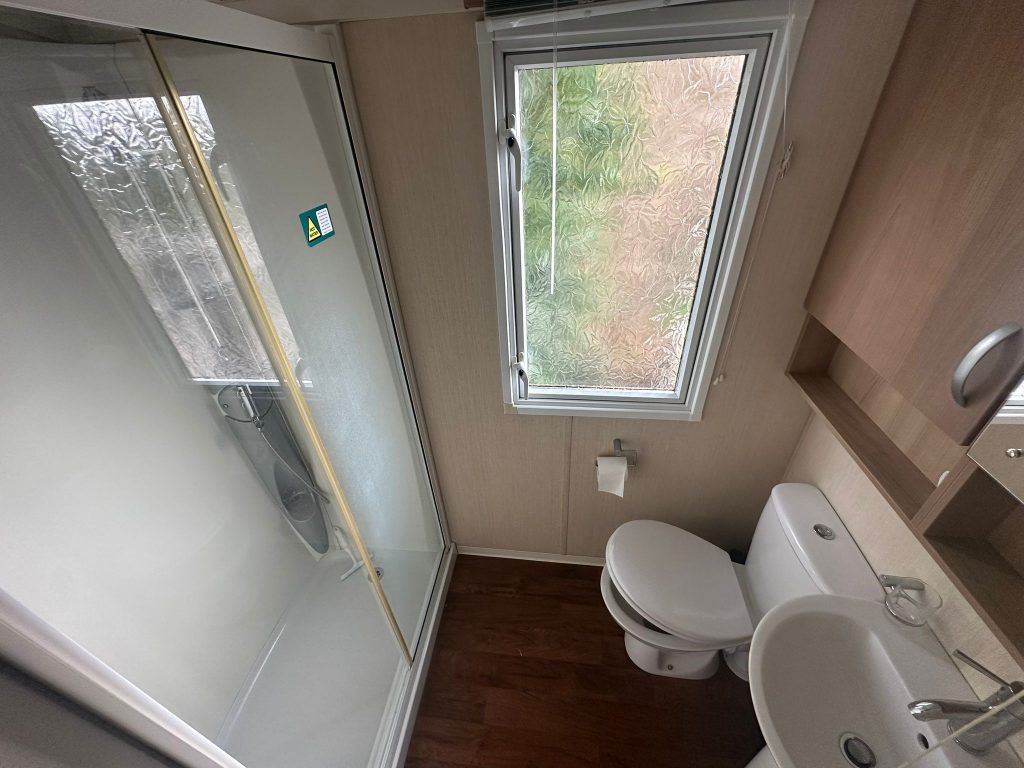 shower cubicle with toilet and wash basin