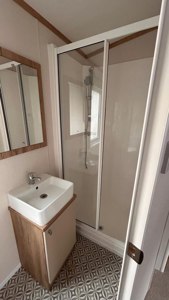 pedestal basin and shower cubicle