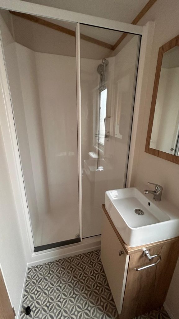 Shower and white sink