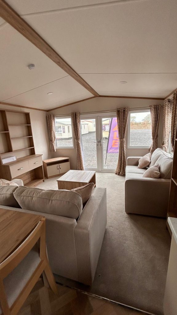 2 sofas in living room with patio doors