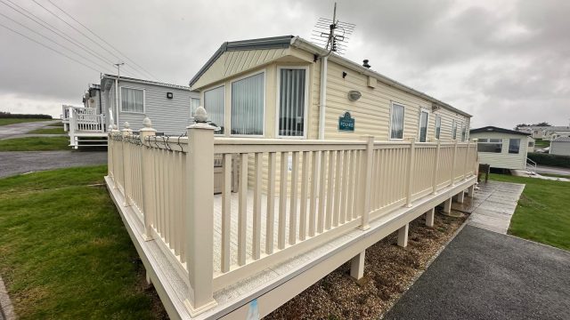cream static caravan with decking