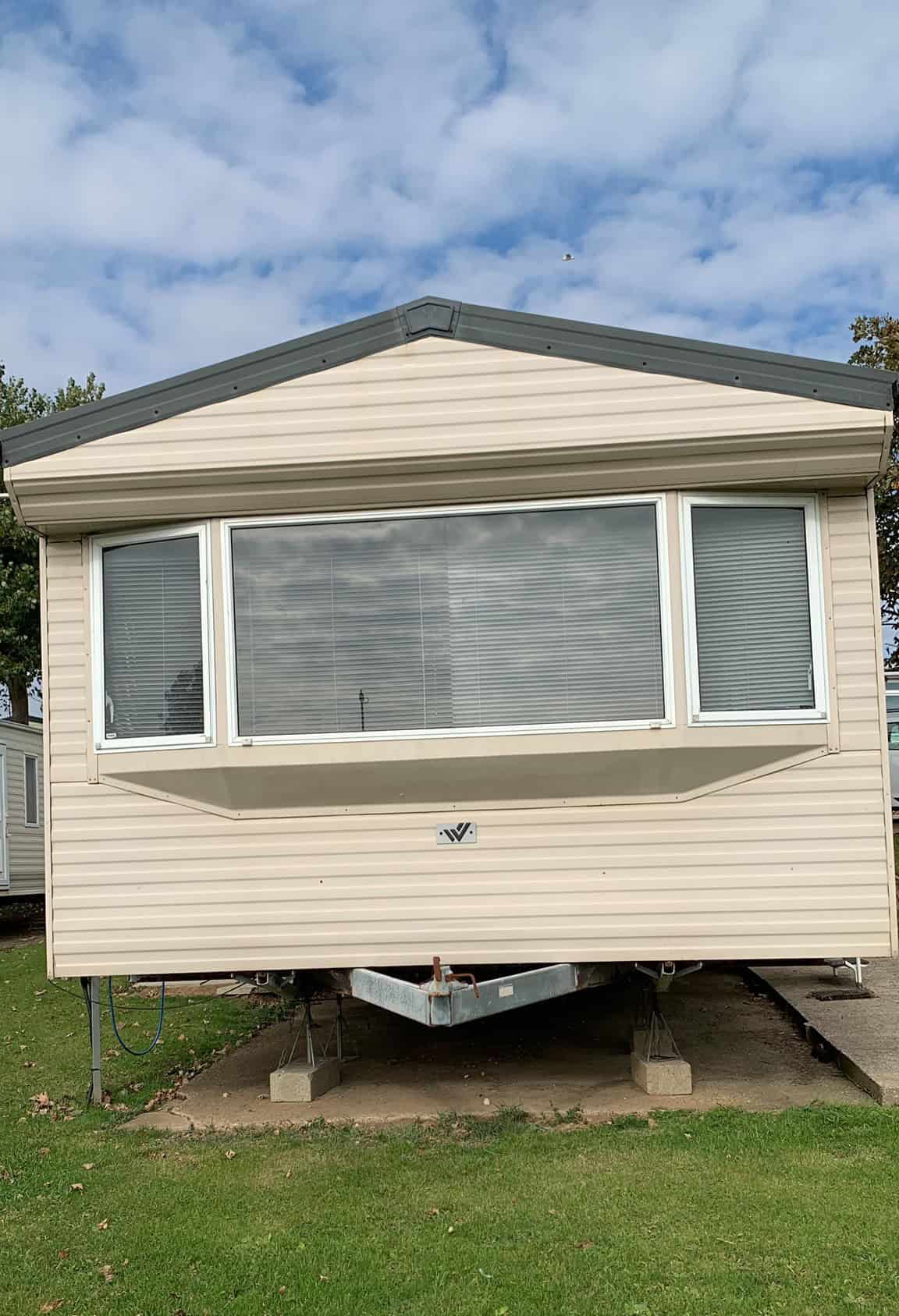 outside front of cream static caravan