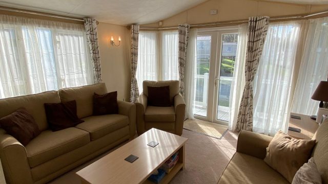 2 sofas and an armchair with coffee table.