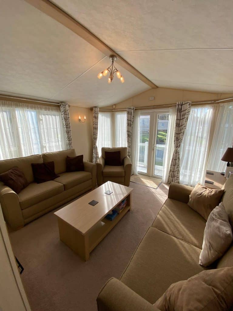 2 sofas and an armchair with coffee table.