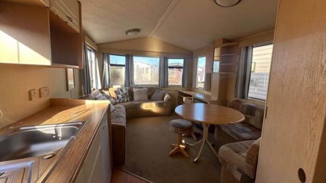 round dining table with stool and fixed seating