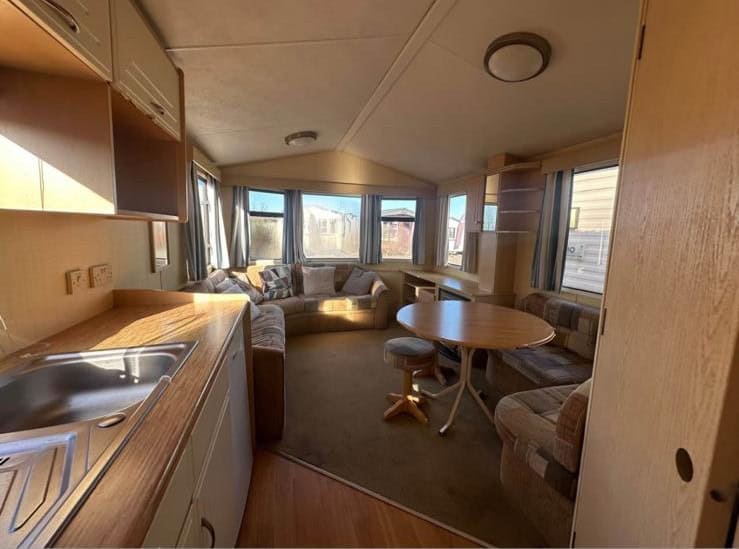 round dining table with stool and fixed seating