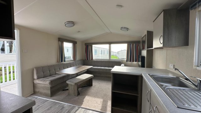 dining table with stool and seating, carpet in lounge