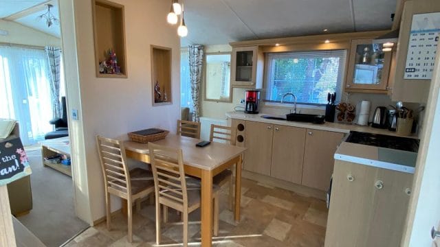 dining table and chairs in fitted kitchen