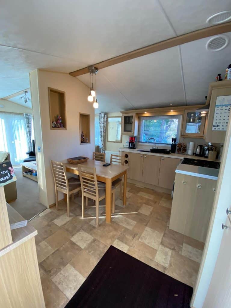 dining table and chairs in fitted kitchen