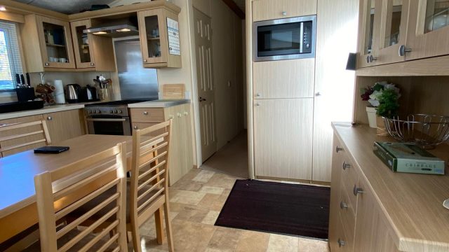 dresser in kitchen with built in microwave