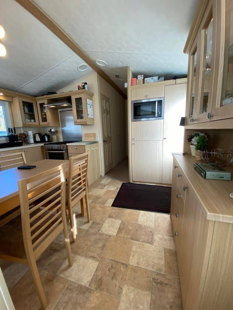 dresser in kitchen with built in microwave