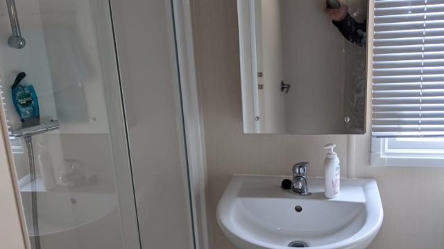 wash basin and shower cubicle