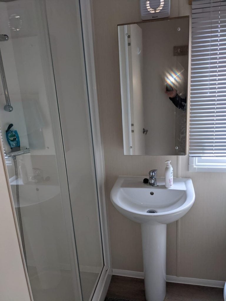 wash basin and shower cubicle