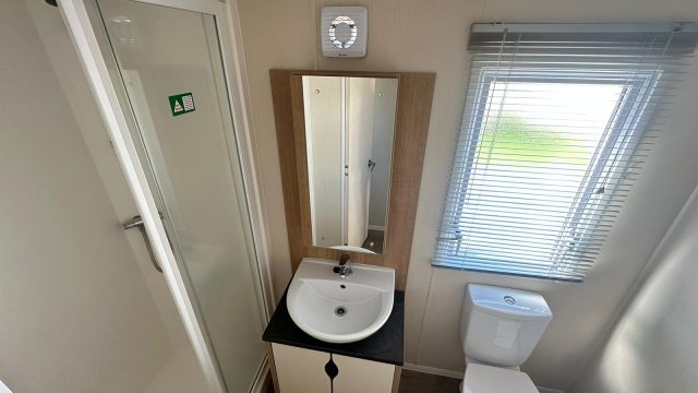 shower room with toilet and hand basin.