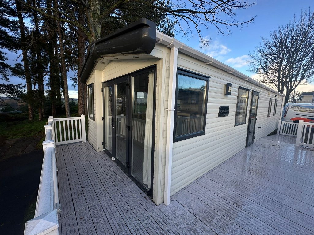 static caravan with patio doors and decking