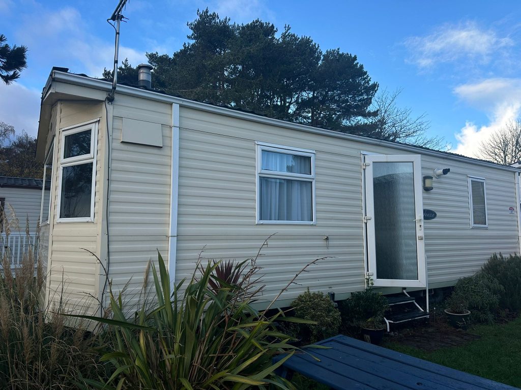 cream static caravan with side door