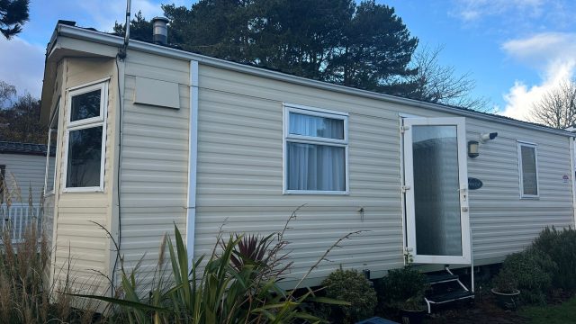 cream static caravan with side door